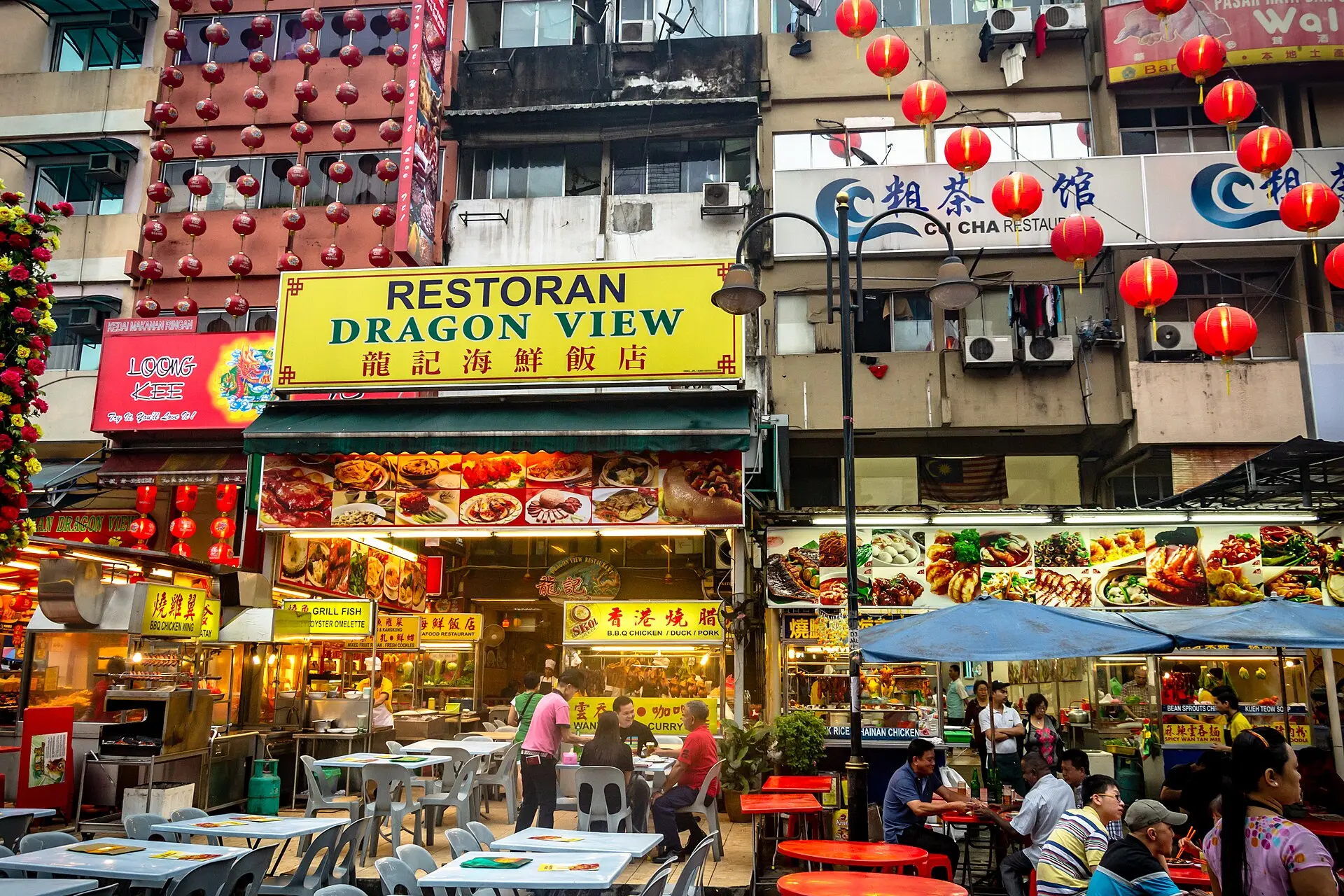 Jalan Alor food street in Kuala Lumpur lined with hawker stalls and outdoor tables