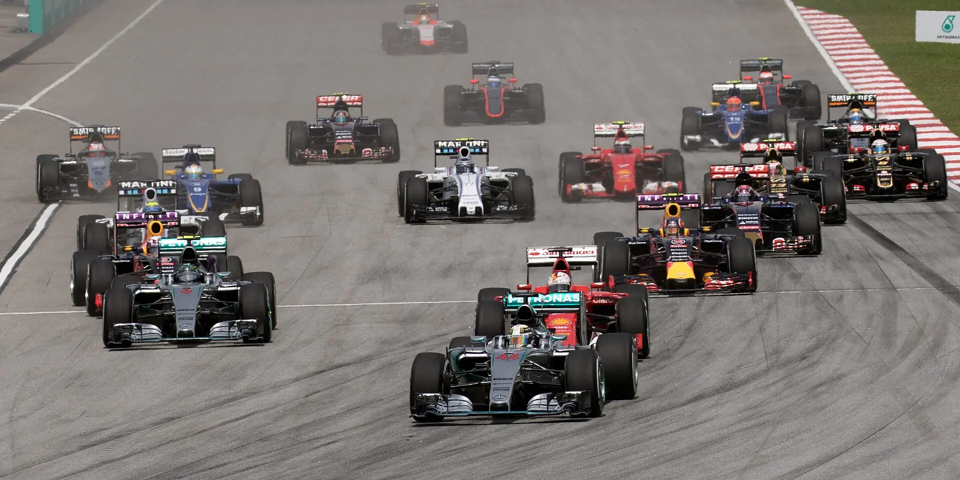 Lewis Hamilton leads the field through Turn 1 on the opening lap of the 2015 Malaysian Grand Prix at Sepang
